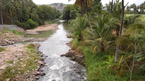 A Beautiful landscape with river stream flowing in Karnataka, India. Stock Footage 247421313