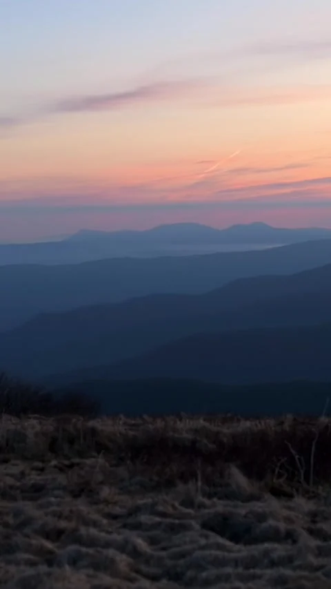 Beautiful landscape of rolling mountain layers at sunset, captured from Roan Видео 286250114