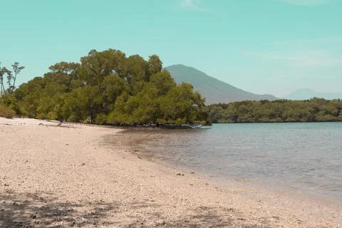 A beautiful landscape of the sea, beach, mangrove forest, and mountains in .. Stock Photos