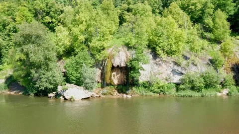 Beautiful landscape with a small waterfall by the river. Stock Footage 119076232