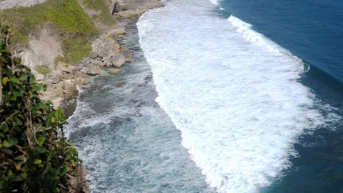 Beautiful landscape of stone cliffs, ocean waves and oceanscape. Aerial top view Stock Footage 92779561