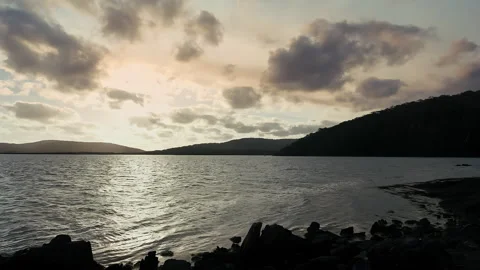 A beautiful landscape with the sunset sun going over the horizon, . Silhouette c Stock Footage 294616334