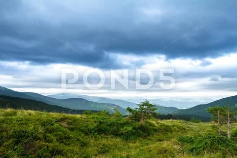 Beautiful landscape of Ukrainian Carpathian mountains and cloudy sky Stock Photos