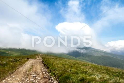 Beautiful landscape of Ukrainian Carpathian mountains and cloudy sky Stock Photos