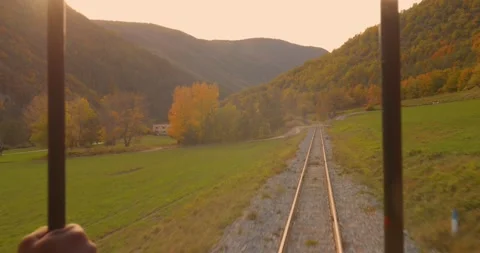Beautiful landscape view from back open side of a train with railway tracks Stock Footage 332970063