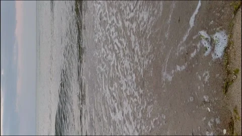 Beautiful landscape, a wave runs on the sandy shore of the Black Sea at suns Stock Footage 160412285
