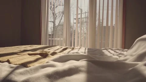 Beautiful large bed and light from the window Stock Footage 233657895