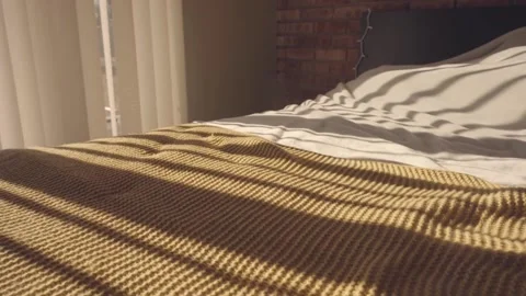 Beautiful large bed and light from the window Stock Footage 233657914