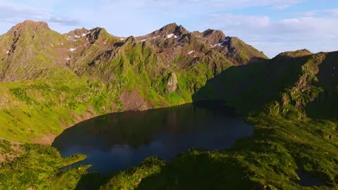 Beautiful large lake with a reflection of the sky between green fjords in Norway Stock Footage 251419167