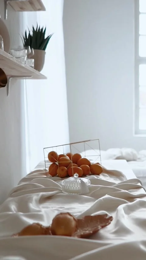 Beautiful large spacious kitchen with a bedroom in a light style, white curtains Stock Footage 276168122