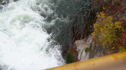 A beautiful large waterfall with cliffs high in the mountains. Travel and hike Stock Footage 325315921