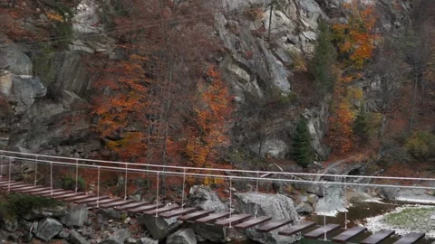 A beautiful large waterfall with cliffs high in the mountains. Travel and hike Stock Footage 325315927