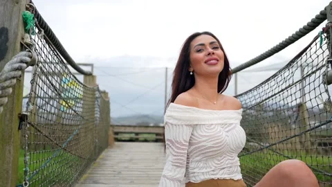 Beautiful latin model posing on rope bridge Stock Footage 308010819