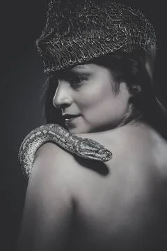 Beautiful latin woman with python snake Stock Photos
