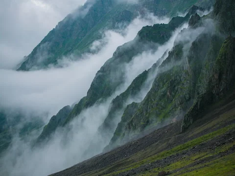 Beautiful layered clouds in mountains timelapse 5k Stock Footage 71677103