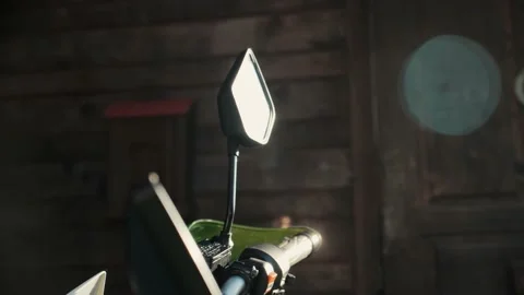 Beautiful lens flare, sun rays reflection in motorcycle rearview mirror glass Stock Footage 206002633