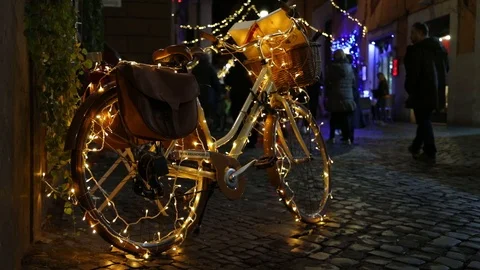 Beautiful light decorations on a bicycle during Christmas time in Rome, Italy Stock Footage 99932894
