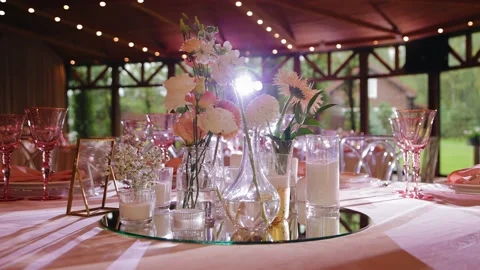 Beautiful light illuminates the fresh flowers standing on the festive table Stock Footage 184425906