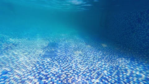 Beautiful light refraction and shadow effects under swimming pool water Stock Footage 344832173