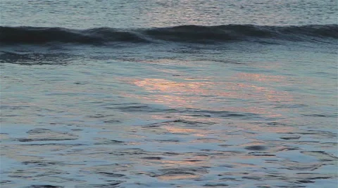 Beautiful Light from Sunset reflecting in the waves of the sea Stock-Footage 46353779