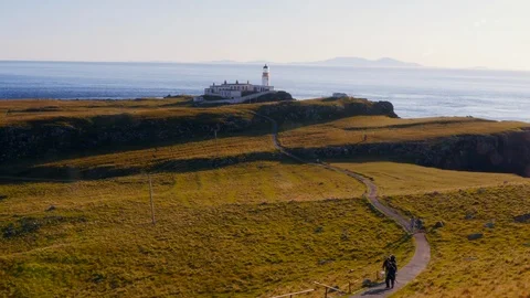 Beautiful lighthouse on a cliff at sunset. Two shots. Stock Footage 97525803