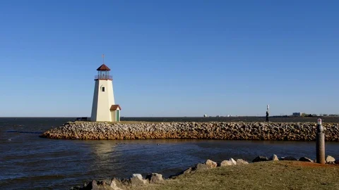 Beautiful Lighthouse on Rock Jetty Stock Footage 97125071
