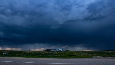 Beautiful Lightning storm over prairie farm house Stock Footage