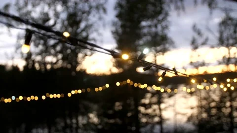 Beautiful lights, lanterns on strings, terrace decoration. Evening Stock Footage 197059324