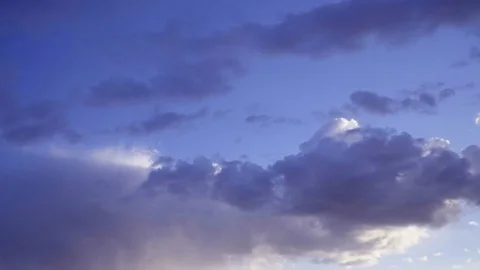 Beautiful lilac clouds are moving across the sky at sunset Stock Footage 74833902