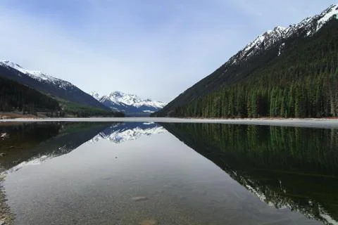 Beautiful lillooet lake on the foot of mountain Stock Photos