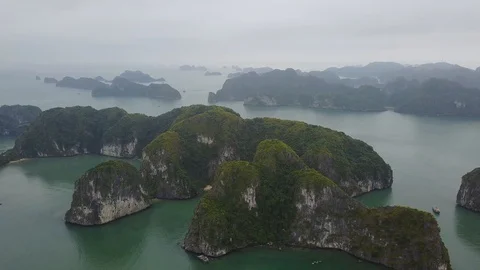 Beautiful limestone cliffs  and islands in Halong Bay, Vietnam, 4k DRONE Stock Footage 100262496