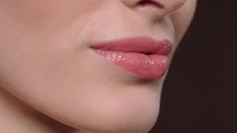 Beautiful lips close-up. Perfect lips small light makeup and clean skin.Part of Stock Footage 148270815