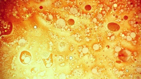 Beautiful liquid orange pattern made ofink and oil Stock Footage 125960324