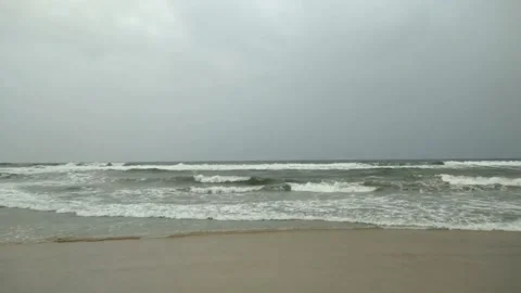 Beautiful lite blue ocean on sandy beach background Video stock 232653997