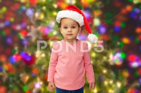 Beautiful little baby girl in christmas santa hat Stock Photos