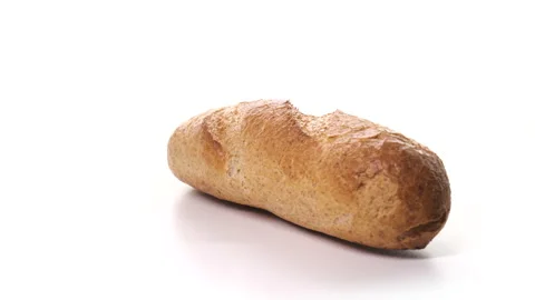 Beautiful loaf of white bread, ready for breakfast on white background. Fresh Stock Footage 148515669