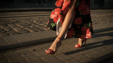 Beautiful long legs model walking around the city on heels in red shoes and a Video stock 137319007