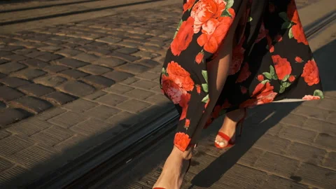 Beautiful long legs model walking around the city on heels in red shoes and a Video stock 137374094