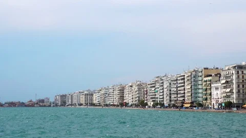 Beautiful low angle steady view on crowded modern hotel villas sea front quay of Stock Footage 94921855
