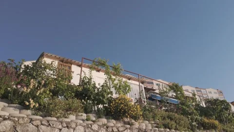 Beautiful low angle view of a seaside house on a sunny day Stock Footage 310946203