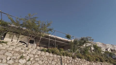 Beautiful low angle view of a seaside house on a sunny day Stock Footage 310946287