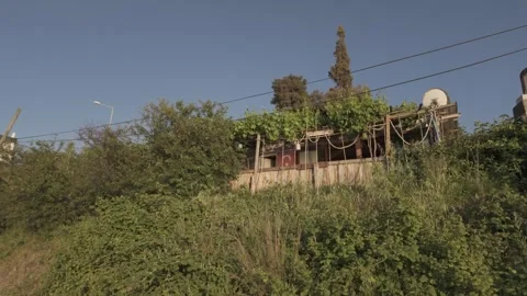 Beautiful low angle view of a seaside house on a sunny day Stock Footage 310946337