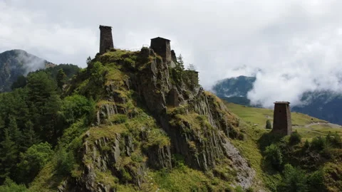 Beautiful low flying view around ancient monastery ruins in Caucasus mountains Stock Footage 229879518
