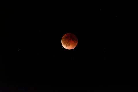 Beautiful lunar eclipse with red moon against dark night sky Blood moon Stock Photos