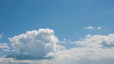 Beautiful lush white clouds float across the blue sky Time Lapse. Cloud Stock Footage 196089553
