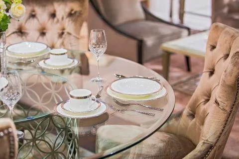 Beautiful luxury serving tableware set. Expensive service in the interior. Stock Photos