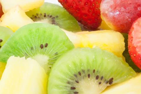 Beautiful macro background of fresh fruit salad on studio Foto stock