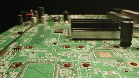 Beautiful macro of a printed circuit board with diodes, transistors and Video stock 315632486