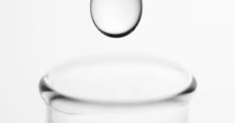Beautiful macro shot of drops falling in test tube Stock Footage 74853831