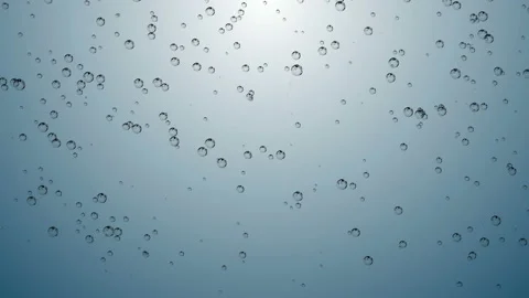 Beautiful macro shot of small and big air bubbles in water rising in slow motion Stock Footage 110698839